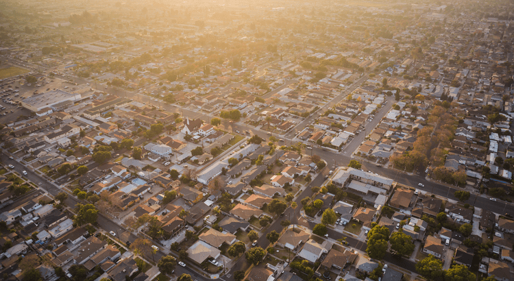 Homeowner reviewing housing market news with a real estate professional