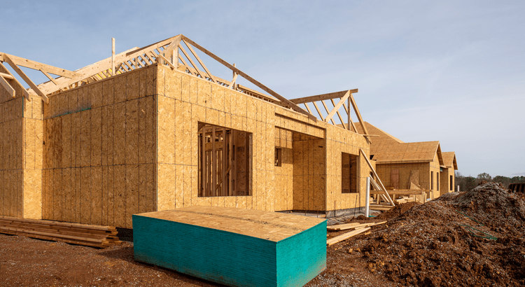 Couple touring a newly built home that&rsquo;s more affordable than existing inventory