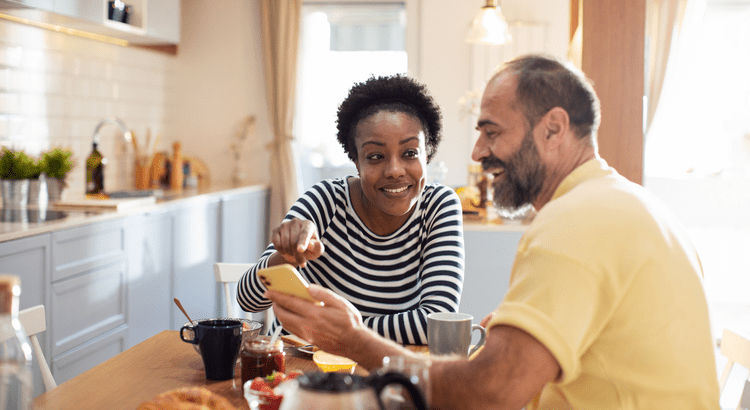 Couple discussing home negotiations with a real estate professional